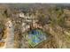 Aerial shot of well-maintained tennis courts in a secluded, wooded setting, perfect for recreational play at 846 Brandy Oaks Ln, Stone Mountain, GA 30088