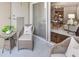 Cozy outdoor balcony with wicker furniture, offering a glimpse into the stylish living area at 325 E Paces Ferry Ne Rd # 410, Atlanta, GA 30305