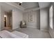 Spacious bedroom boasting a tray ceiling, carpet, and multiple closets at 325 E Paces Ferry Ne Rd # 410, Atlanta, GA 30305