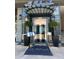 Elegant building entrance with a decorative canopy and potted plants, offering a welcoming first impression at 325 E Paces Ferry Ne Rd # 410, Atlanta, GA 30305