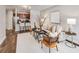 Bright living room with contemporary decor, plush seating, and a view to the kitchen with breakfast bar at 325 E Paces Ferry Ne Rd # 410, Atlanta, GA 30305