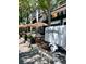 Charming outdoor dining area with striped umbrellas and comfortable seating, creating an inviting ambiance at 325 E Paces Ferry Ne Rd # 410, Atlanta, GA 30305
