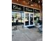 Blue Moon Pizza entrance with clear windows, black trim and outdoor seating at 325 E Paces Ferry Ne Rd # 410, Atlanta, GA 30305