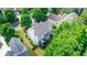 A well-maintained backyard with a deck, green grass and nice landscaping at 3980 Suwanee Place Dr, Suwanee, GA 30024