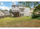 Spacious backyard with patio, deck, and lush green lawn at 3980 Suwanee Place Dr, Suwanee, GA 30024
