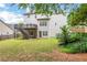 Large backyard featuring lush green lawn and mature trees at 3980 Suwanee Place Dr, Suwanee, GA 30024