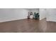 Finished basement features wood floors, ample lighting, and space for multiple uses at 3980 Suwanee Place Dr, Suwanee, GA 30024