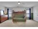 Bedroom featuring bunk beds, a fan and a dresser with a mirror at 3980 Suwanee Place Dr, Suwanee, GA 30024