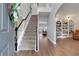 Elegant foyer with staircase, hardwood floors, and an open view to a living space at 3980 Suwanee Place Dr, Suwanee, GA 30024