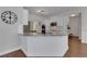 Bright kitchen features granite countertops, stainless steel appliances and hardwood floors at 3980 Suwanee Place Dr, Suwanee, GA 30024