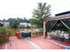 Backyard with a large wooden deck, an outdoor gazebo, and a waterfront view at 4000 Longlake Dr, Duluth, GA 30097