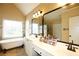 Elegant bathroom with dual sinks, soaking tub, and tiled shower at 4000 Longlake Dr, Duluth, GA 30097