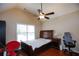Bedroom featuring hardwood floors, a ceiling fan and natural light from the window at 4000 Longlake Dr, Duluth, GA 30097