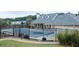 Community pool area with fencing in front of building, perfect for relaxing and enjoying the view at 4000 Longlake Dr, Duluth, GA 30097