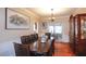 Formal dining room with large table, chandelier, and wooden floors at 4000 Longlake Dr, Duluth, GA 30097