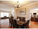 Dining room with long table, china cabinet, chandelier and access to other rooms at 4000 Longlake Dr, Duluth, GA 30097
