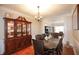 Elegant dining room with a long wooden table and classic decor at 4000 Longlake Dr, Duluth, GA 30097
