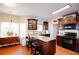 Well-lit kitchen features custom cabinetry, granite countertops, and modern appliances at 4000 Longlake Dr, Duluth, GA 30097