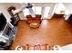 Bird's eye view of living room showcasing rich wood floors, fireplace, and elegant furnishings at 4000 Longlake Dr, Duluth, GA 30097