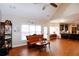 Open concept living area with hardwood floors and access to the kitchen at 4000 Longlake Dr, Duluth, GA 30097