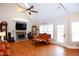 Bright living room with vaulted ceiling, fireplace, and hardwood floors at 4000 Longlake Dr, Duluth, GA 30097