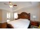 Comfortable main bedroom with access to the en-suite bathroom, side tables and lamps at 4000 Longlake Dr, Duluth, GA 30097