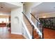 Traditional staircase with wooden steps and white railing in a bright home at 4000 Longlake Dr, Duluth, GA 30097