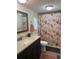 Bathroom featuring a vanity with sink, toilet, and shower with rose and bird decorative shower curtain at 4282 By Pass, Loganville, GA 30052
