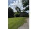 A cozy home featuring a well-maintained yard with mature trees and a driveway at 4282 By Pass, Loganville, GA 30052
