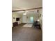 Spacious living room with ceiling fan, a beamed ceiling, neutral walls, and ample natural light at 4282 By Pass, Loganville, GA 30052
