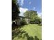 The side yard is lush and green, offering ample space for outdoor activities and relaxation at 4282 By Pass, Loganville, GA 30052