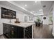 Basement bar offers a refined space with seating, complemented by stylish decor and an open dining area at 4960 Norman Ct, Cumming, GA 30040