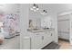 This is a full bath with dual sinks, gray countertops, white cabinets and shower at 4960 Norman Ct, Cumming, GA 30040