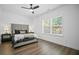 Cozy bedroom with a queen bed, soft neutral tones, and two windows at 4960 Norman Ct, Cumming, GA 30040