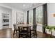 Cozy dining area with a round wooden table, modern decor, and natural light at 4960 Norman Ct, Cumming, GA 30040