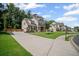 Well-maintained property featuring a long driveway and lush green lawn at 4960 Norman Ct, Cumming, GA 30040