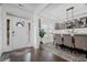 Elegant foyer with hardwood floors, natural light, and a dining area with stylish decor at 4960 Norman Ct, Cumming, GA 30040