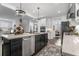 Modern kitchen with stainless steel appliances, a large island, and contemporary lighting at 4960 Norman Ct, Cumming, GA 30040