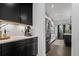 Stylish kitchen with dark cabinets, a stainless steel refrigerator, and modern lighting at 4960 Norman Ct, Cumming, GA 30040