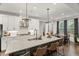 Bright kitchen features a large island, pendant lighting, and stainless steel appliances at 4960 Norman Ct, Cumming, GA 30040