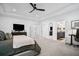 This is a bright and spacious main bedroom suite with trey ceilings and a neutral color palette at 4960 Norman Ct, Cumming, GA 30040