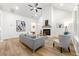 Cozy living room showcases modern decor, vaulted ceiling, hardwood floors, and lots of natural light at 8544 Plumtree Dr, Riverdale, GA 30274