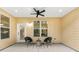 Covered patio with ceiling fan and seating, ideal for relaxing outdoors at 8544 Plumtree Dr, Riverdale, GA 30274
