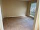 Spacious bedroom with neutral walls and carpet, featuring a window providing natural light at 1570 Twin Bridge Ln, Lawrenceville, GA 30043