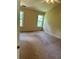 Large bedroom with neutral walls, carpeted floor, and two windows offering natural light at 1570 Twin Bridge Ln, Lawrenceville, GA 30043