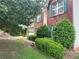 A classic brick home with green shutters and lush landscaping, offering curb appeal and charm at 1570 Twin Bridge Ln, Lawrenceville, GA 30043