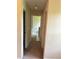 Hallway leading to different rooms, offering a glimpse of a bathroom and other living spaces at 1570 Twin Bridge Ln, Lawrenceville, GA 30043
