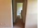 Hallway view, showing a glimpse into the bathroom and adjacent rooms of the home at 1570 Twin Bridge Ln, Lawrenceville, GA 30043