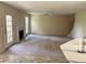 Open living room featuring a fireplace, ceiling fan, and access to the outdoors at 1570 Twin Bridge Ln, Lawrenceville, GA 30043