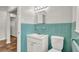 Vintage bathroom with turquoise tile, classic sink with vanity, and matching toilet at 2261 Star Mist Sw Dr, Atlanta, GA 30311